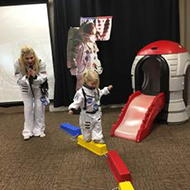 Kid in a Space Suit Balancing